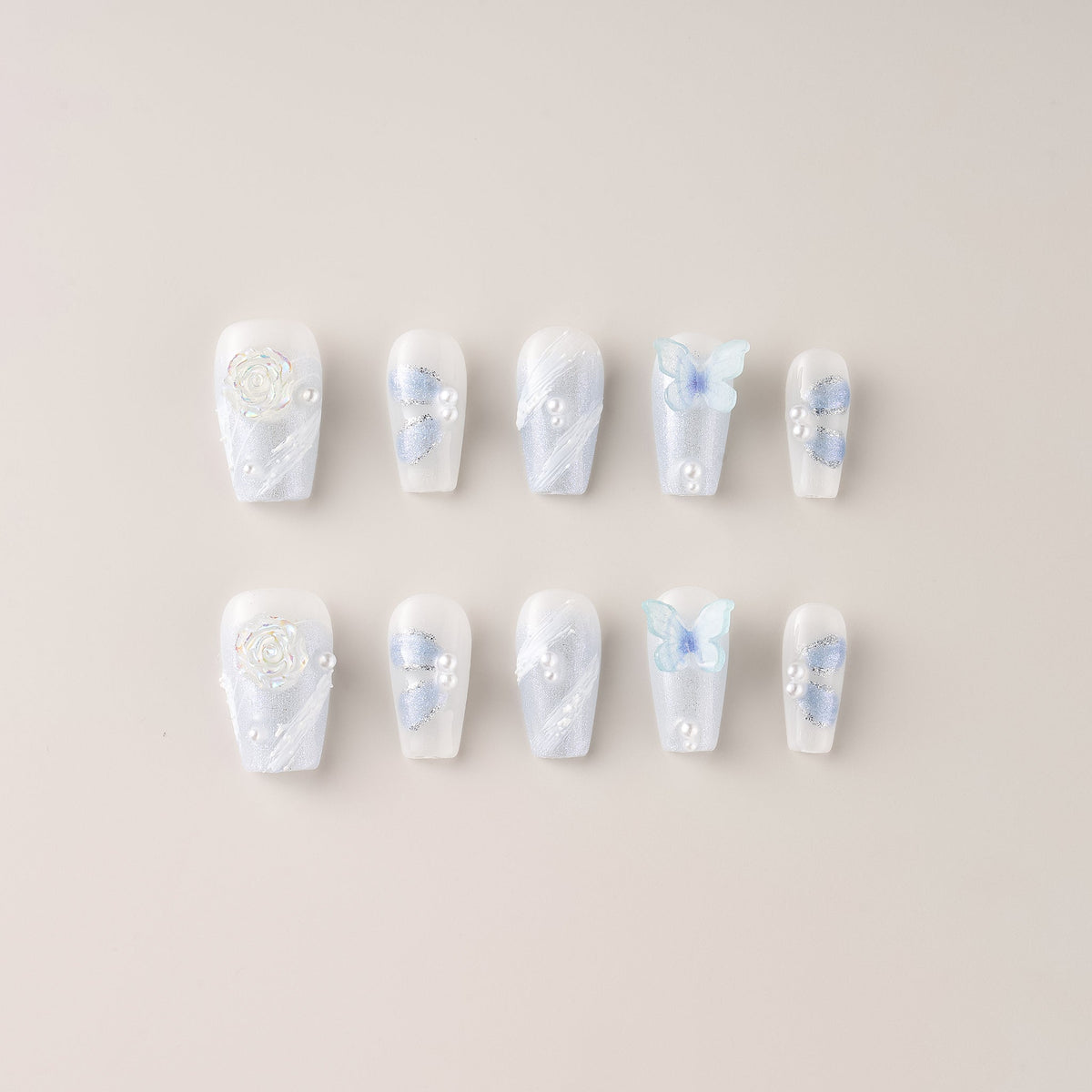 Icy blue and periwinkle butterfly press-on nails from NailPop